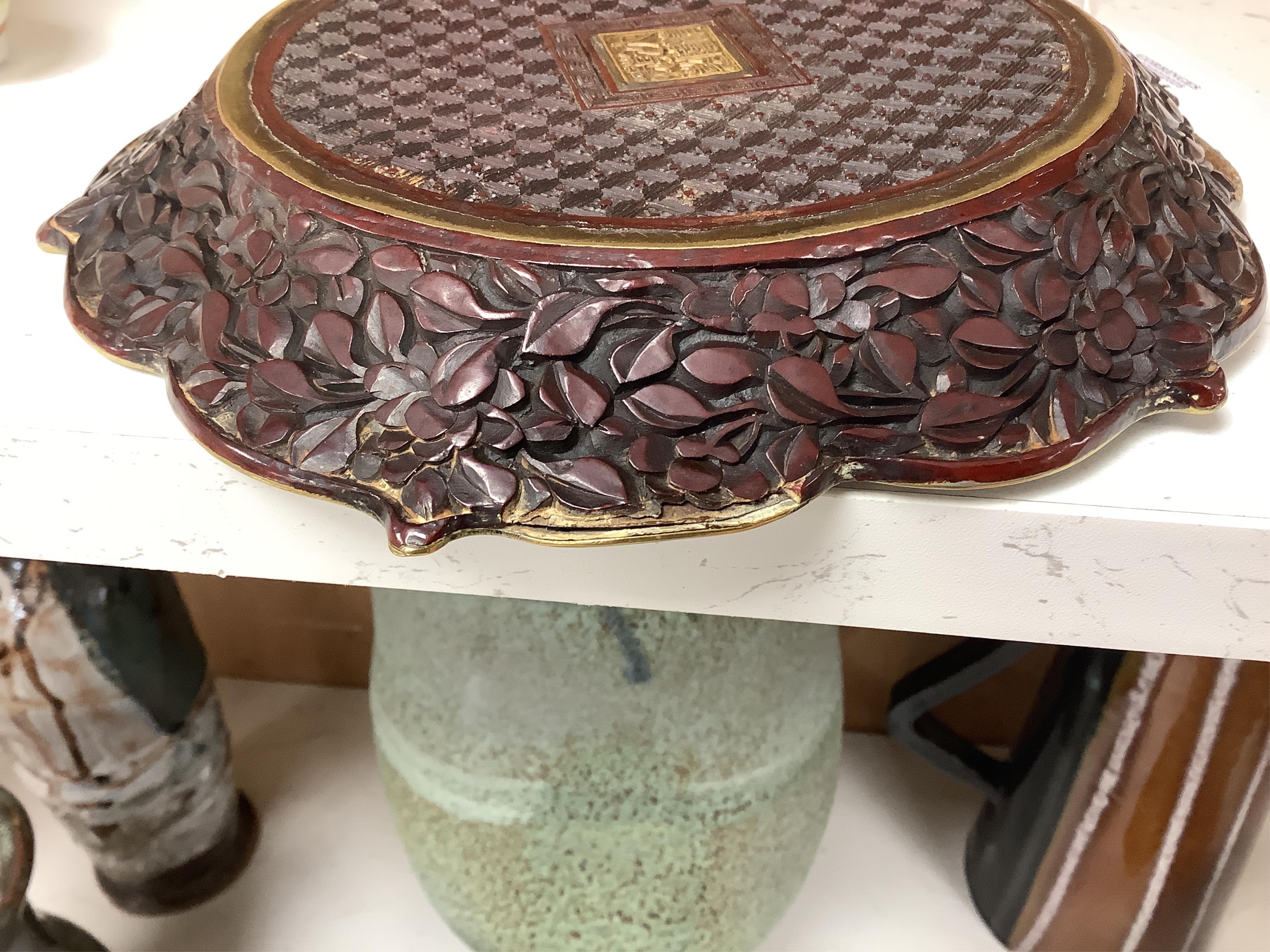A Chinese lacquer foliate-shaped dish on stand, 18cm in diameter